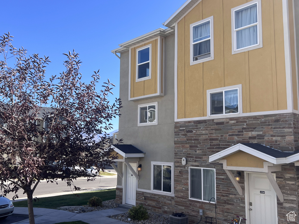 View of front of house with central AC