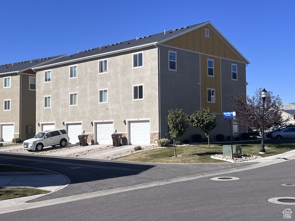 View of property featuring a garage