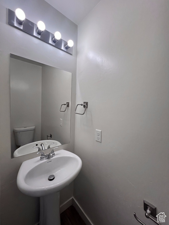 Bathroom featuring toilet and sink