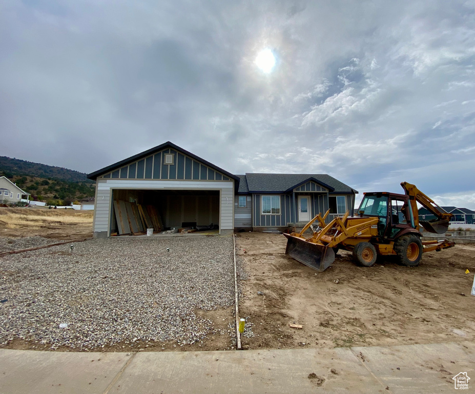 View of outbuilding featuring a garage