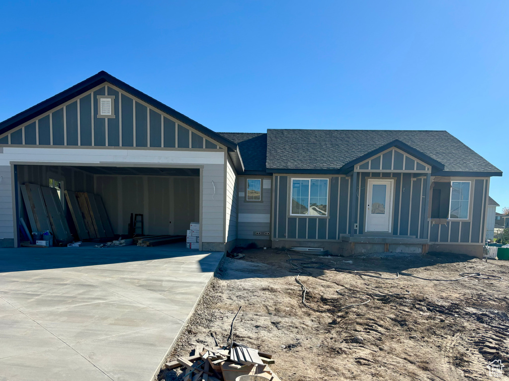 View of front facade featuring a garage