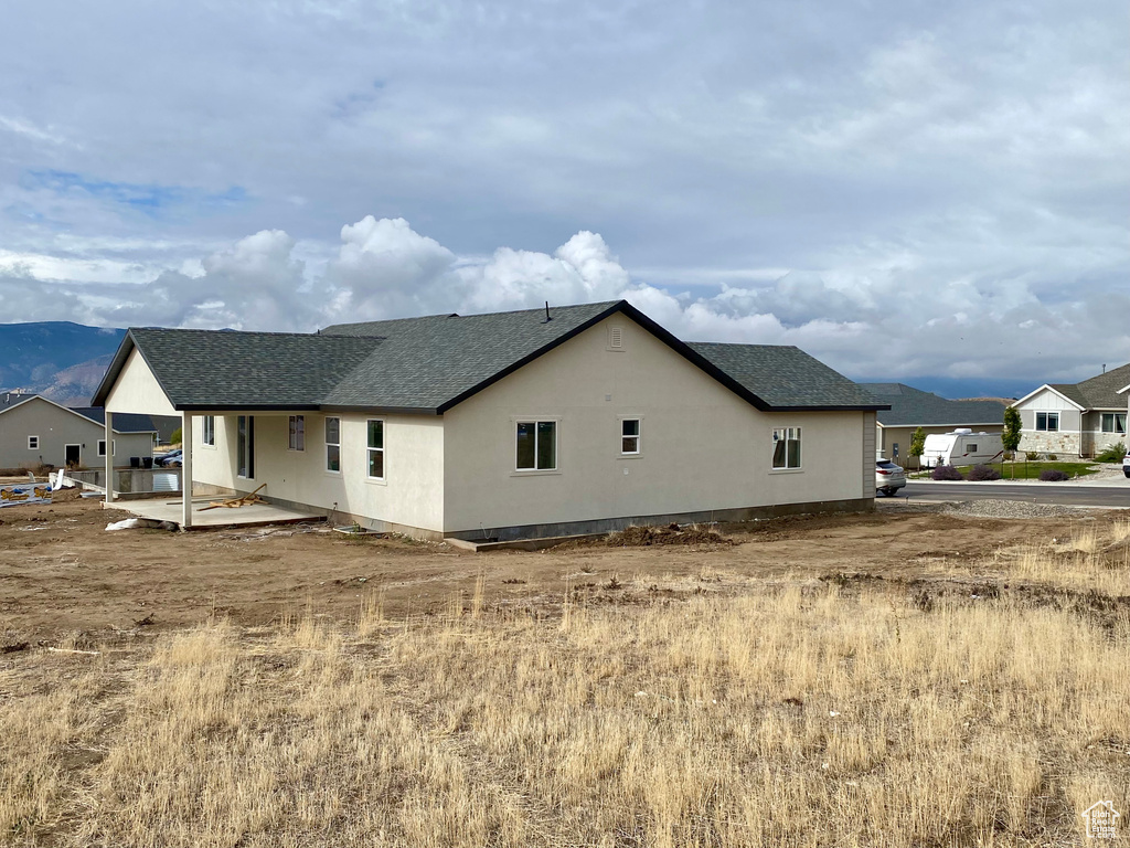 View of side of property with a mountain view