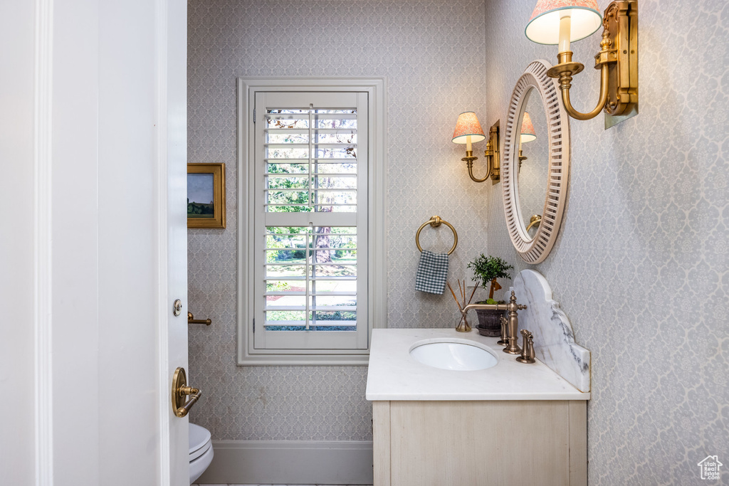 Bathroom featuring vanity and toilet