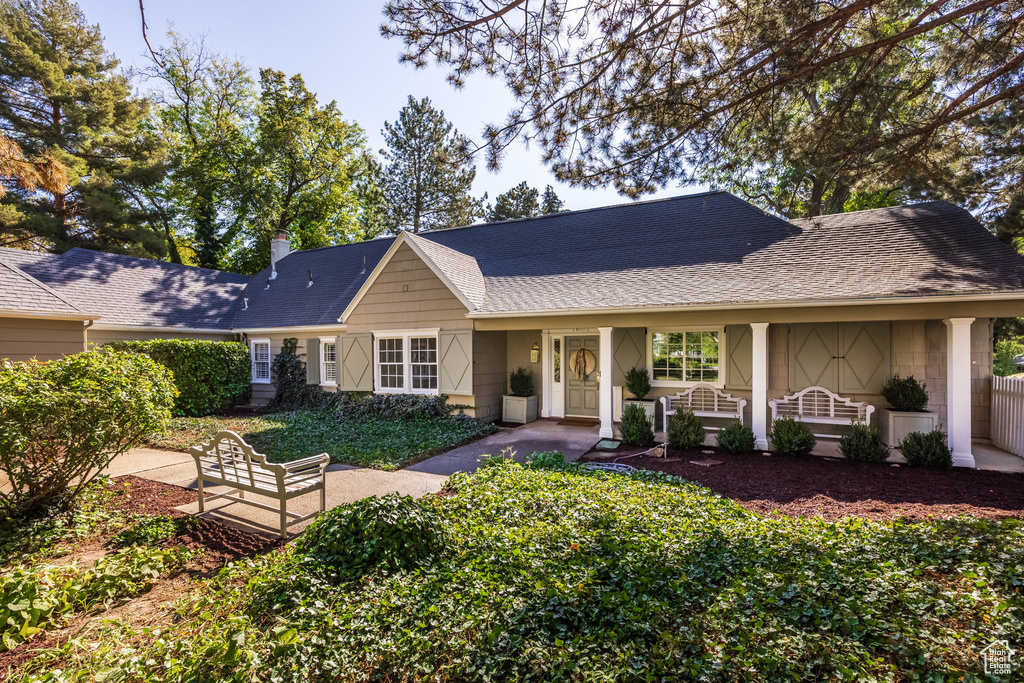 Back of property featuring a porch