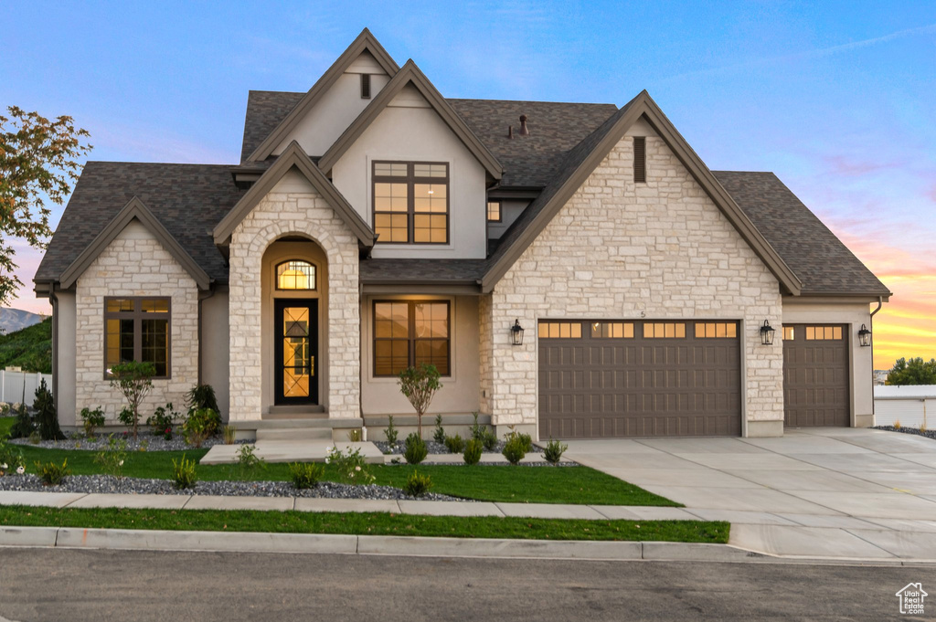 View of front of property featuring a garage