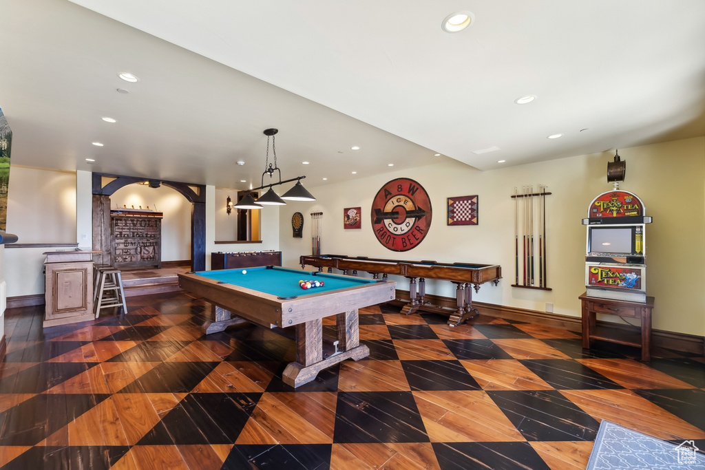 Game room featuring dark hardwood / wood-style flooring and pool table