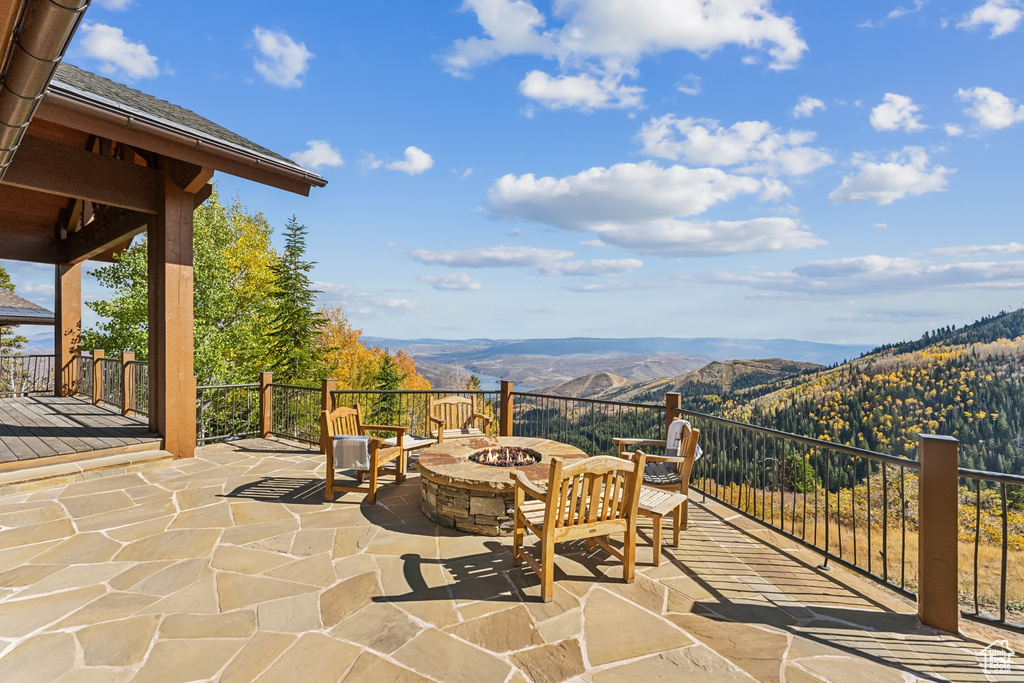 View of patio featuring a mountain view and a fire pit