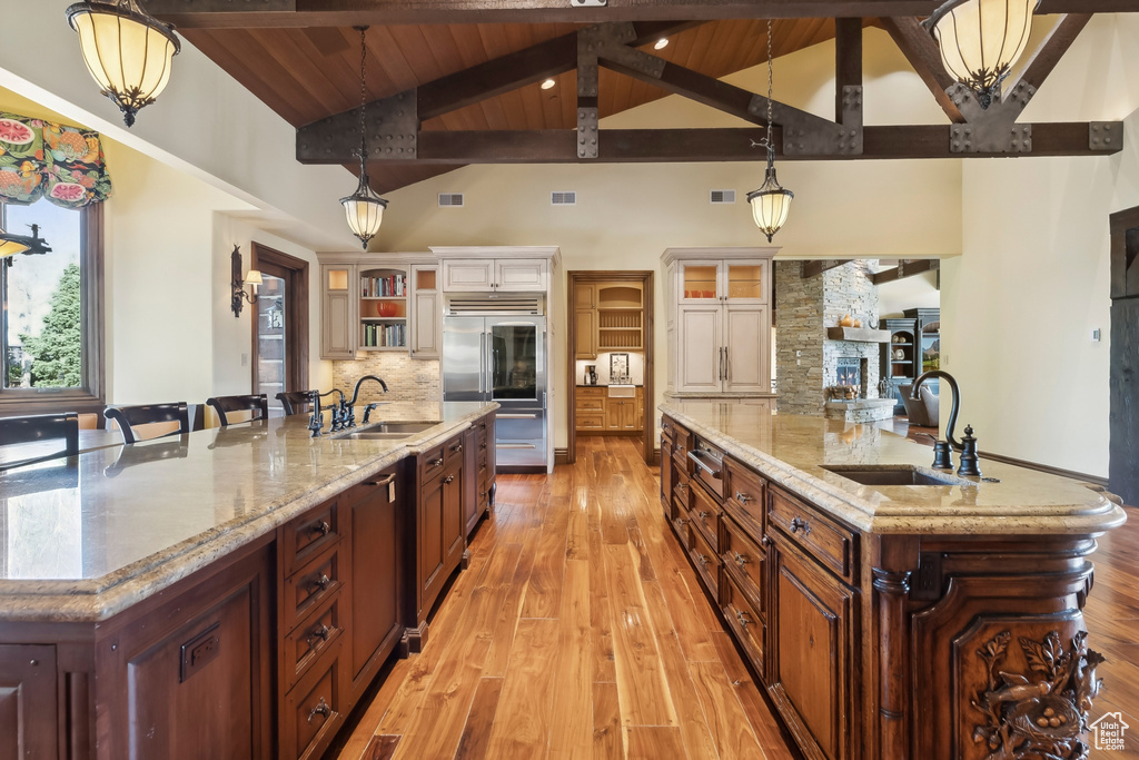 Kitchen with a breakfast bar, sink, and pendant lighting