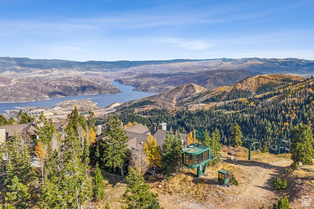 Drone / aerial view featuring a water and mountain view