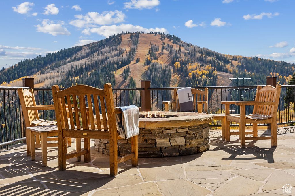 View of patio / terrace featuring a mountain view and a fire pit