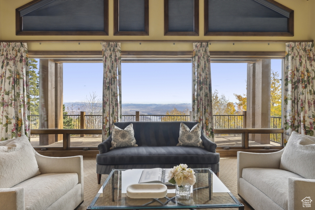 Living room featuring a mountain view and a healthy amount of sunlight