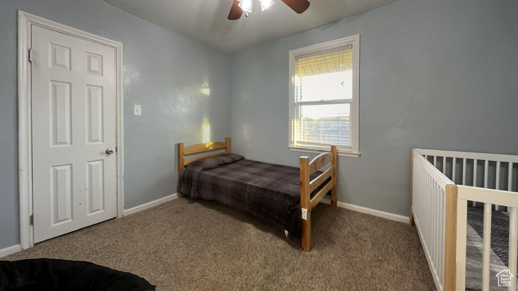 Bedroom featuring carpet and ceiling fan