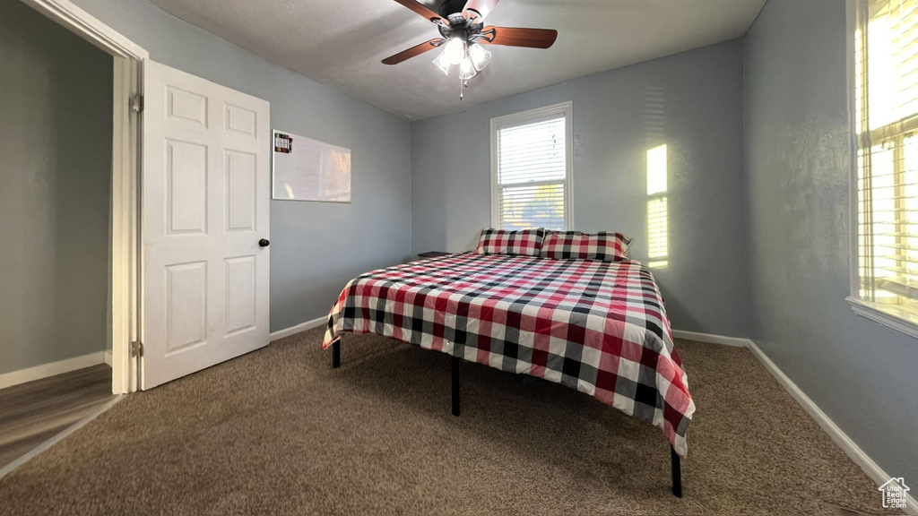 Bedroom featuring carpet and ceiling fan