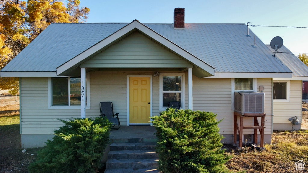 View of front of property with central AC unit