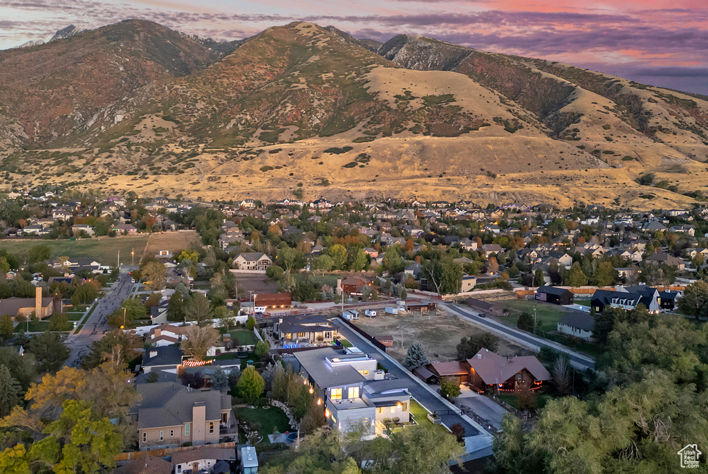 Aerial view at dusk featuring a mountain view