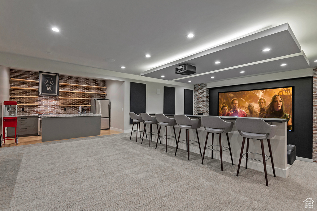 Cinema with sink and light colored carpet