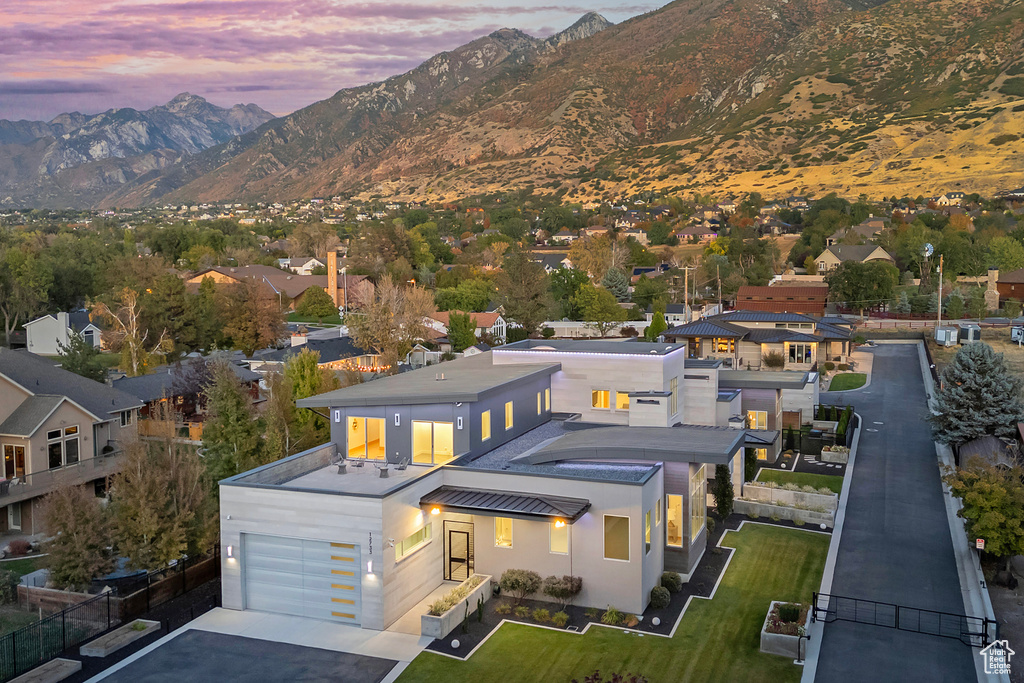 Aerial view at dusk featuring a mountain view