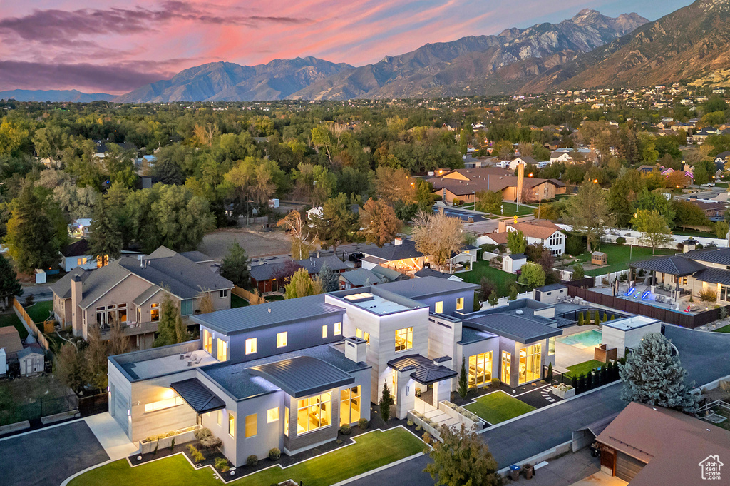 Aerial view at dusk featuring a mountain view