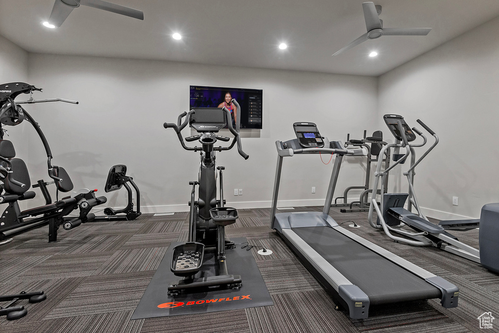 Exercise room featuring dark colored carpet