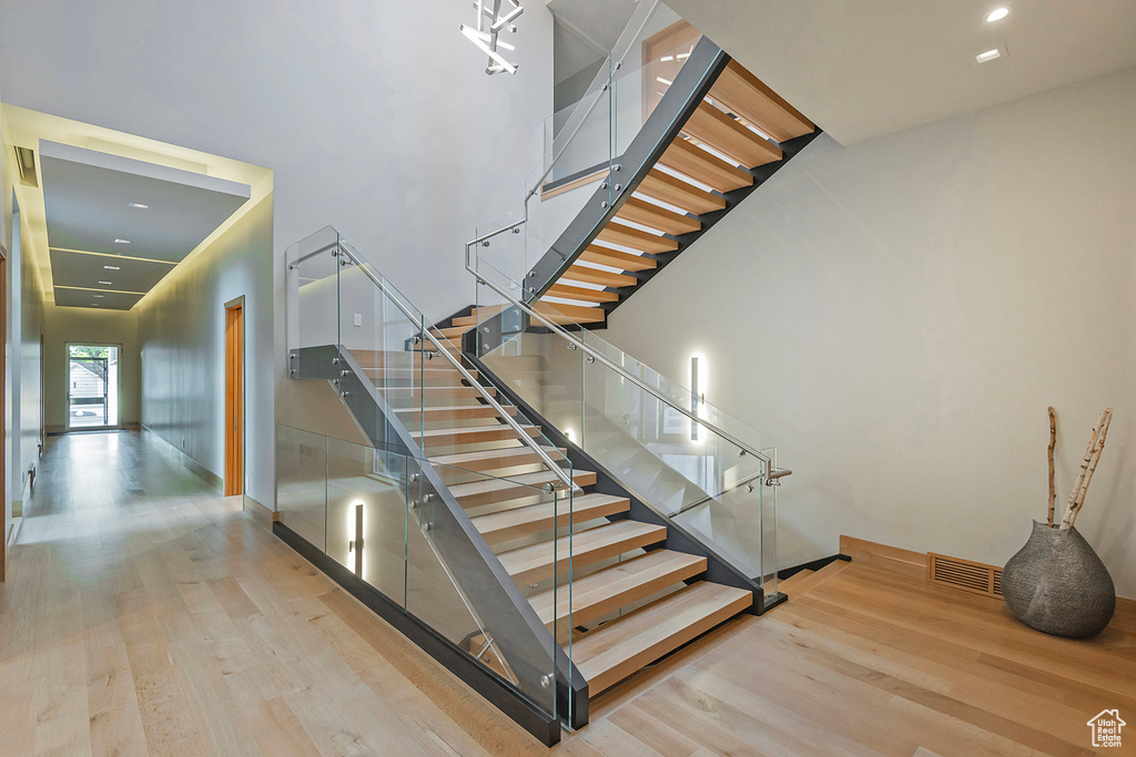 Stairway featuring wood-type flooring