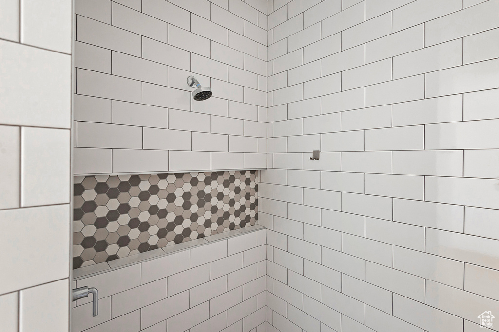 Bathroom featuring tiled shower