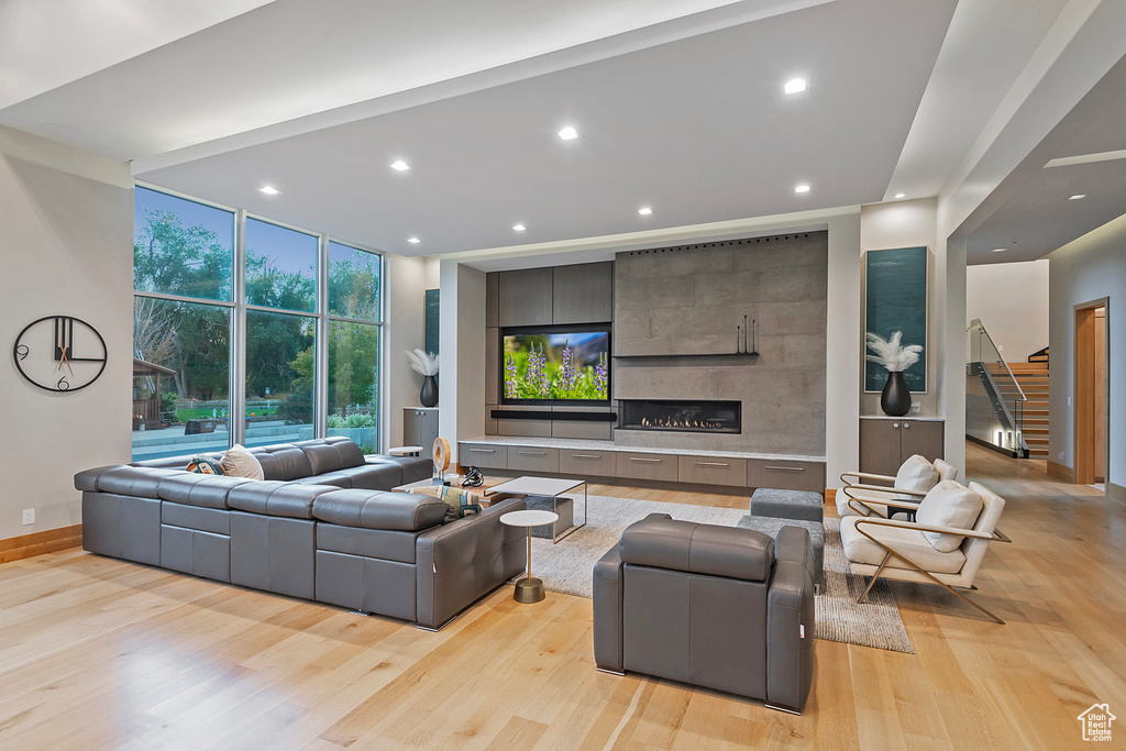 Living room featuring light hardwood / wood-style flooring and a fireplace