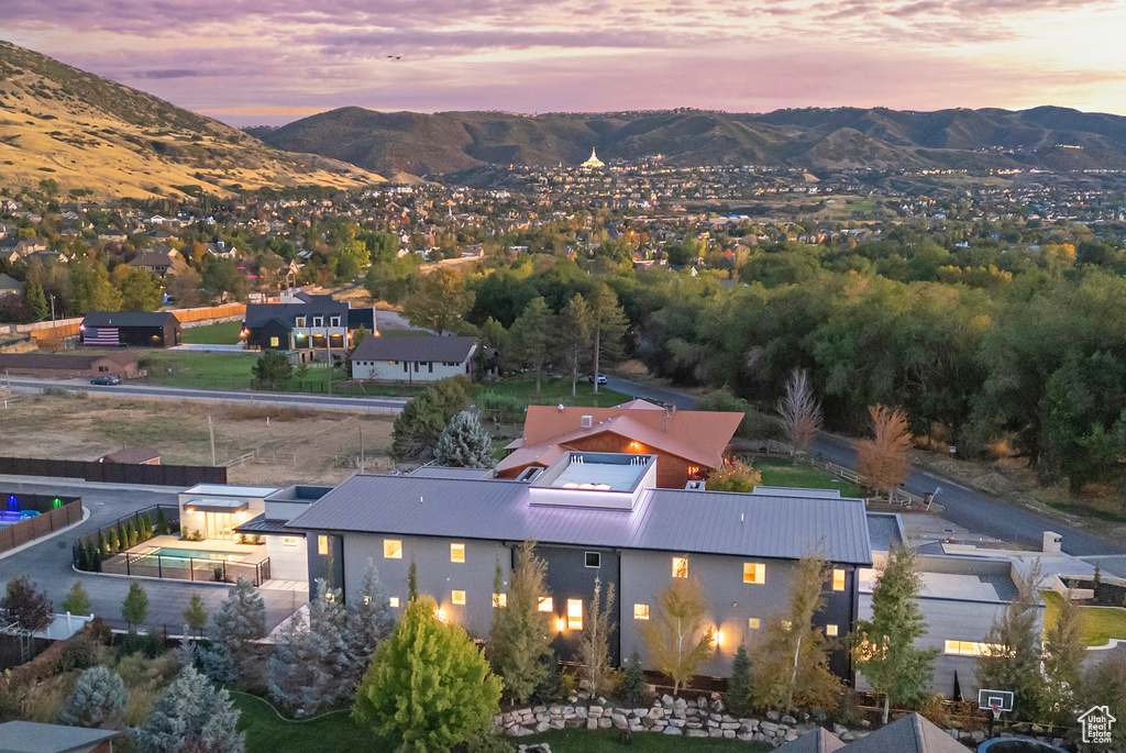 Aerial view at dusk featuring a mountain view