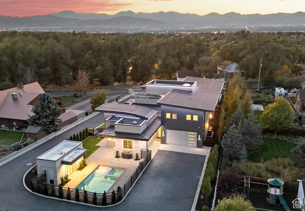 Aerial view at dusk featuring a mountain view