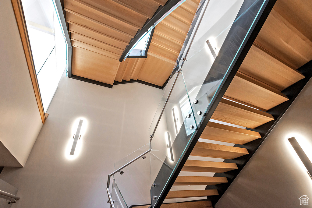 Stairs featuring wood ceiling