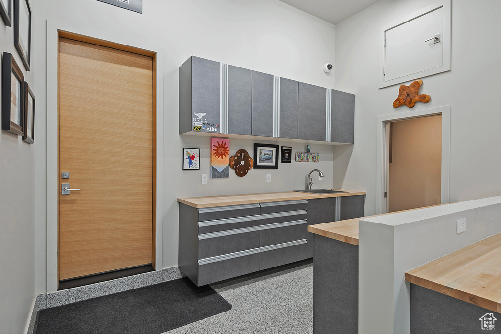 Kitchen featuring sink and gray cabinetry