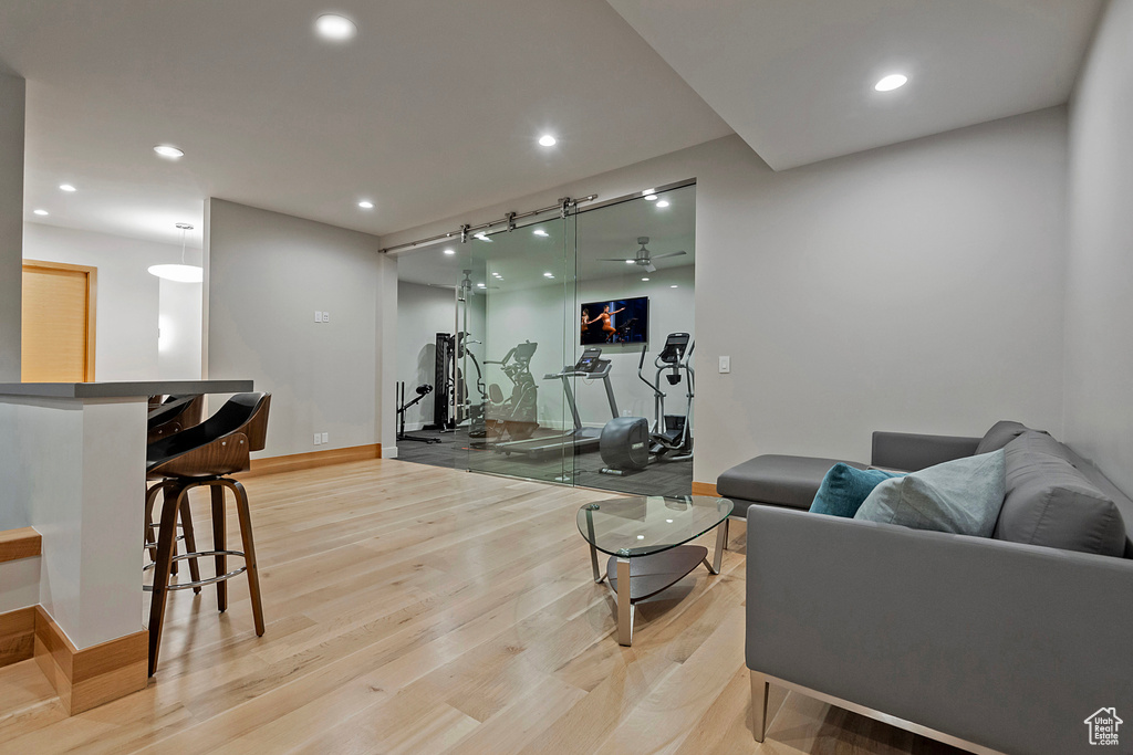 Workout room with light wood-type flooring