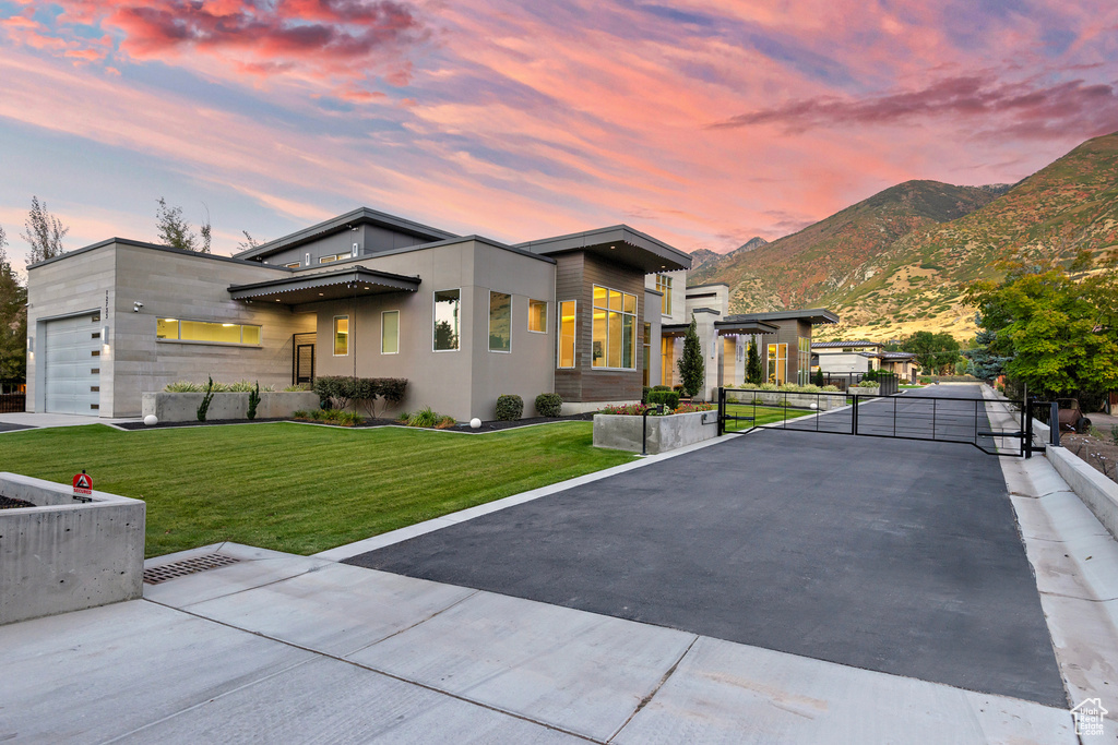 Contemporary house with a mountain view and a yard