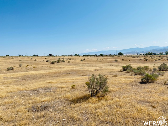 Property view of mountains featuring a rural view