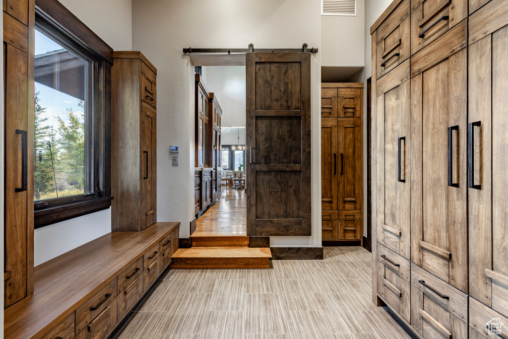 Mudroom with a barn door