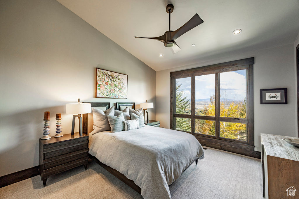 Bedroom with vaulted ceiling, light carpet, recessed lighting, and a ceiling fan