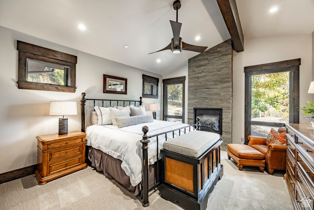 Bedroom featuring light carpet, recessed lighting, a stone fireplace, baseboards, and a ceiling fan
