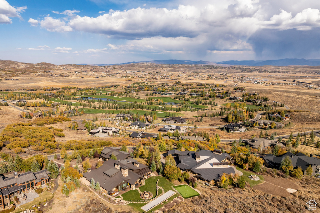 View of property location featuring a mountain backdrop and nearby suburban area