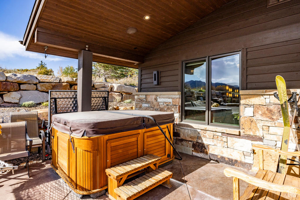 View of patio featuring a hot tub