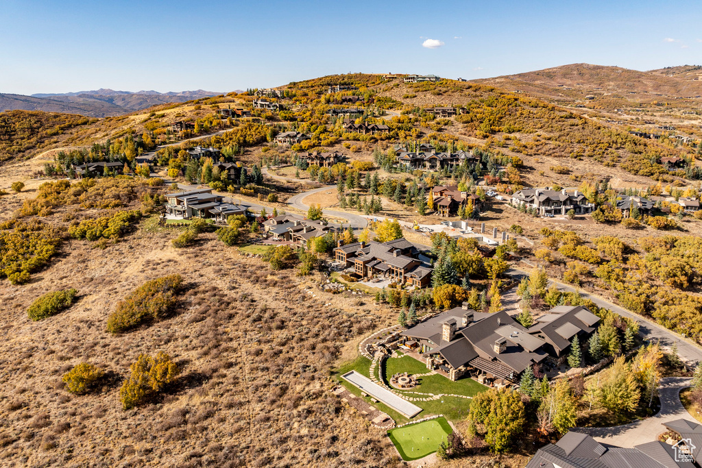 Aerial perspective of suburban area featuring a mountainous background