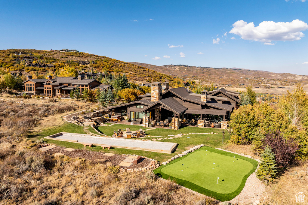 Aerial view of property and surrounding area with mountains