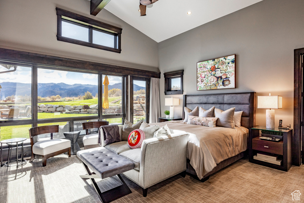 Bedroom with high vaulted ceiling and a mountain view