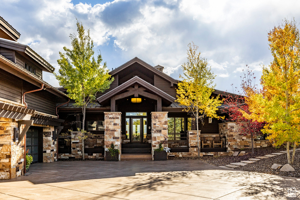 View of building exterior featuring concrete driveway