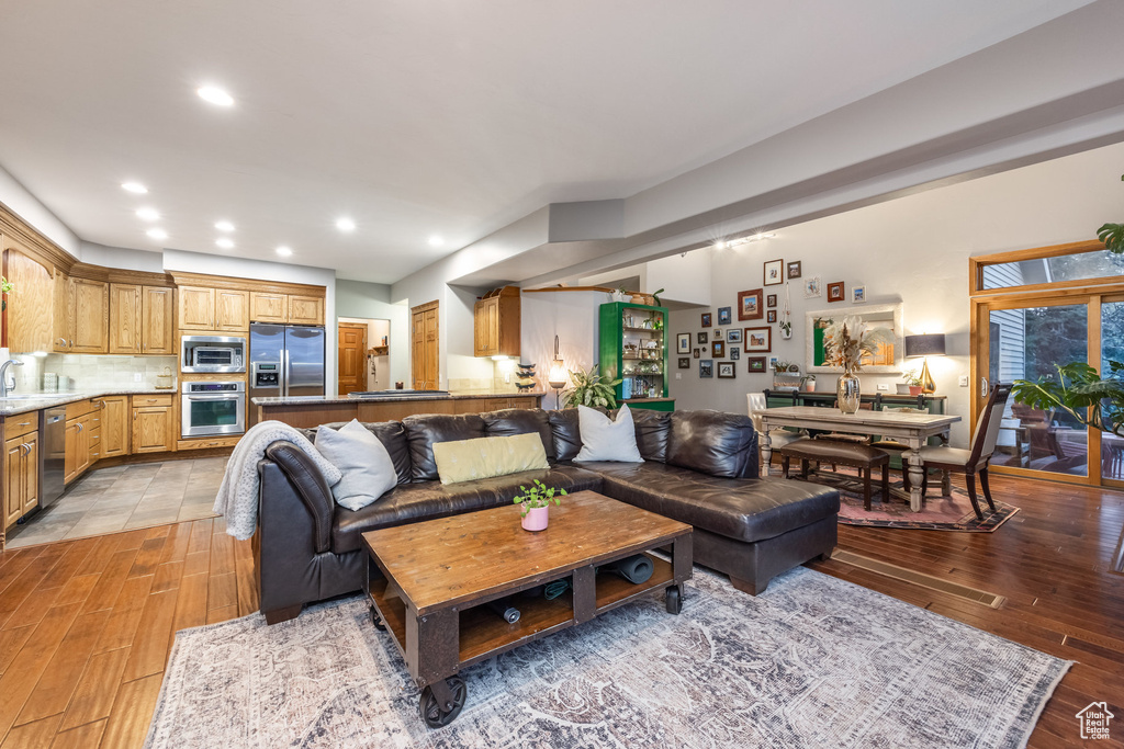 Living room with light hardwood / wood-style floors