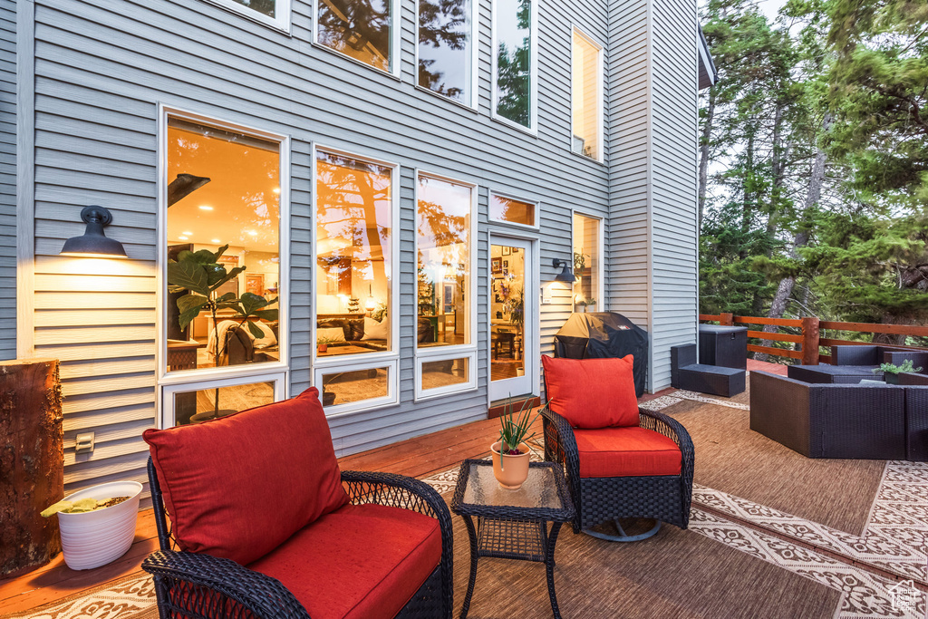 View of patio featuring outdoor lounge area, a deck, and a grill