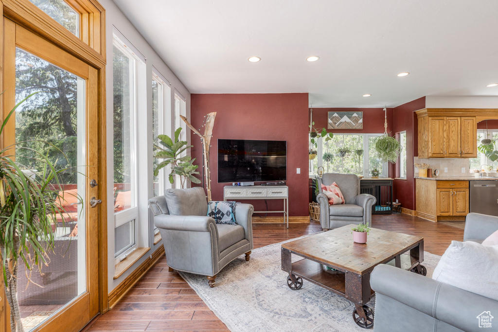 Living area with recessed lighting and wood finished floors