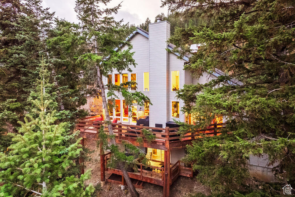 View of side of property with a deck