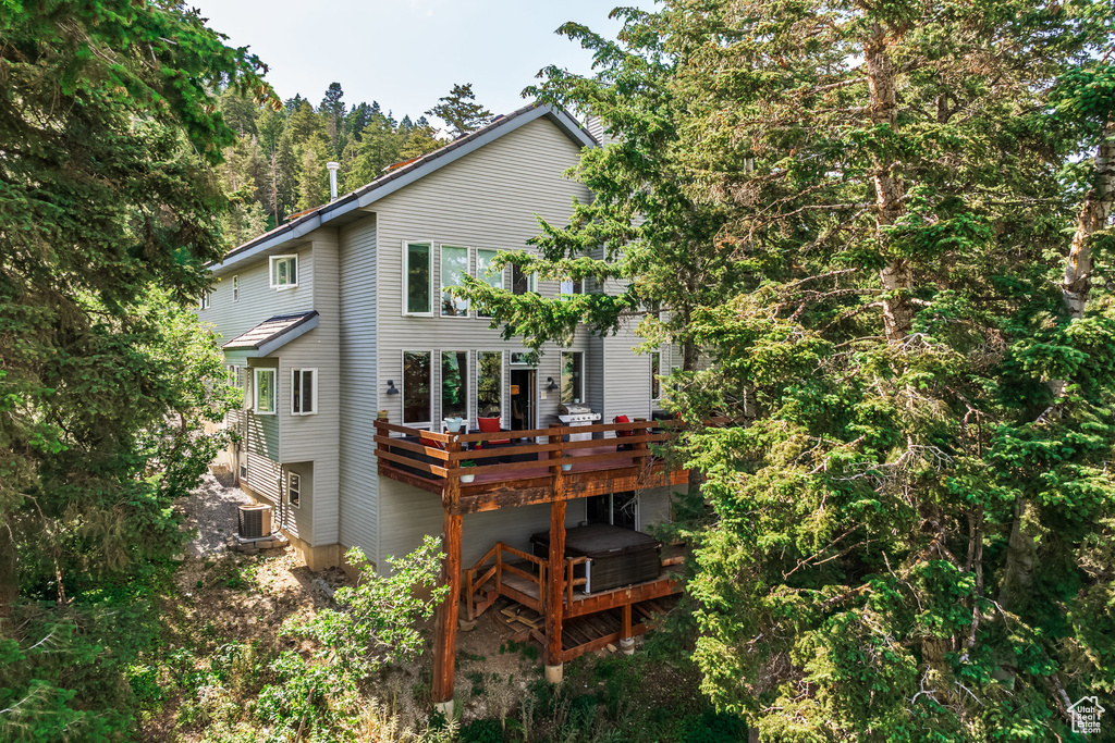 Rear view of property with a deck