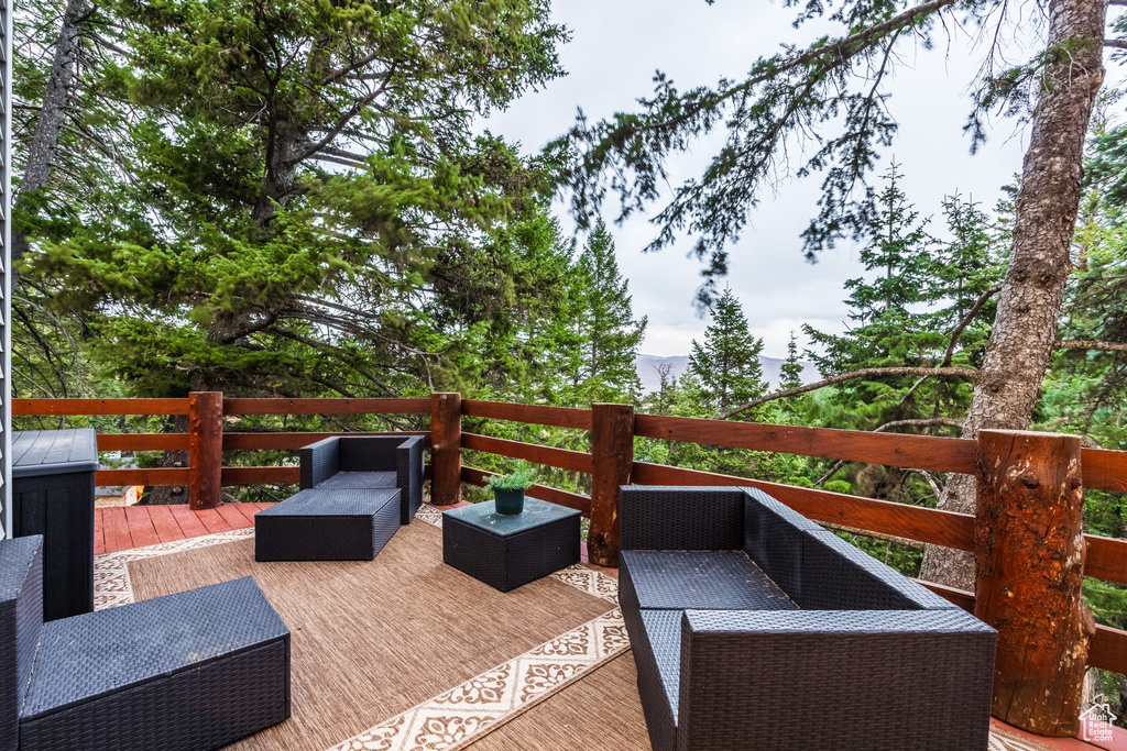 Wooden terrace with an outdoor hangout area
