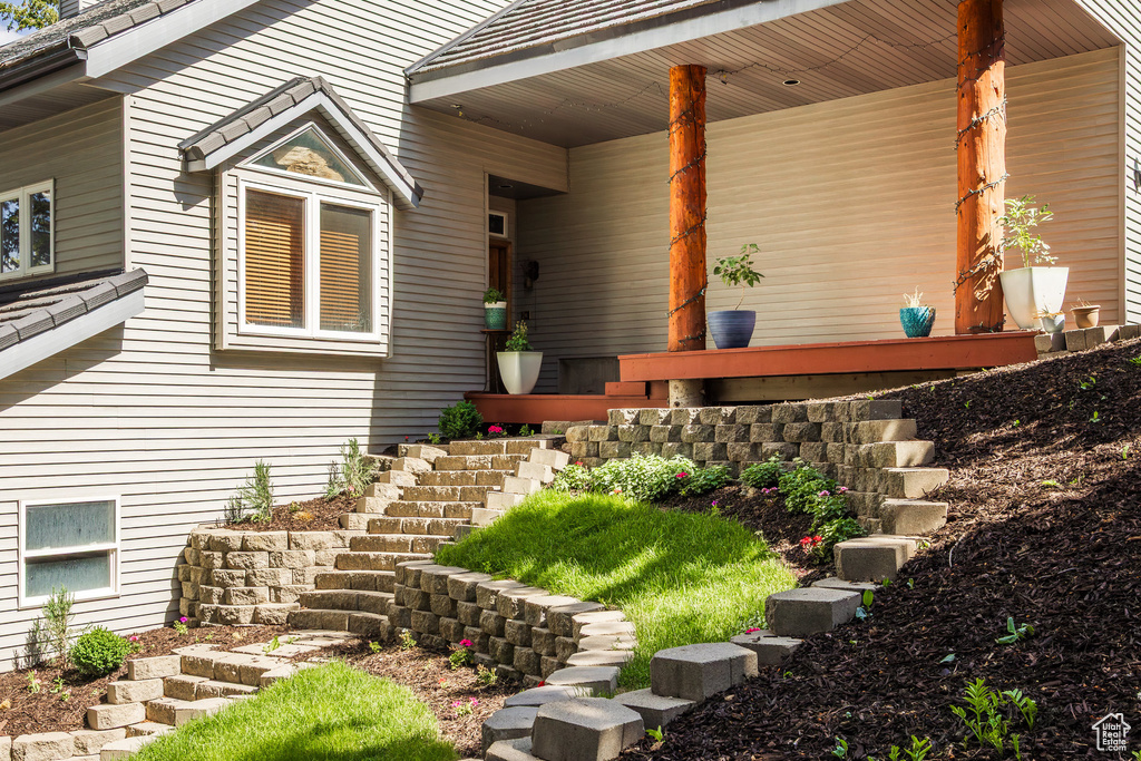 View of exterior entry with a porch