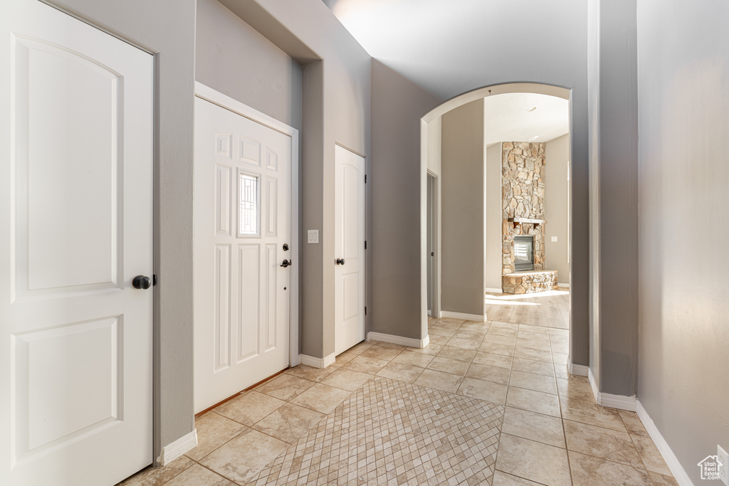 Foyer entrance with light tile patterned floors